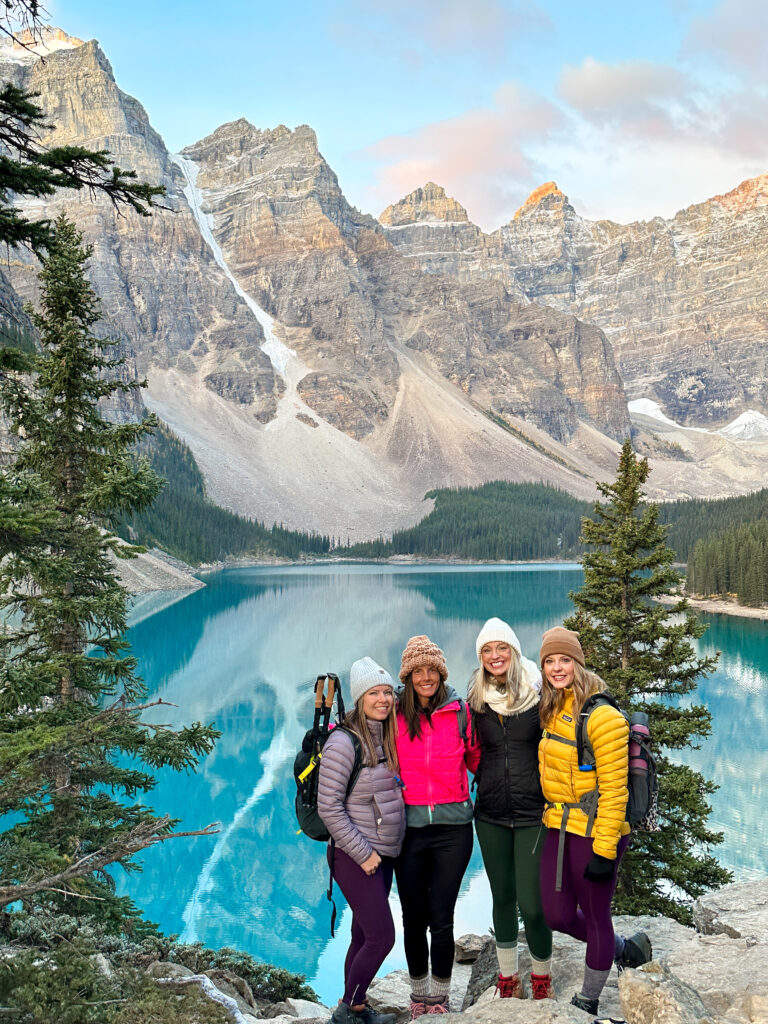 Girlfriends during sunrise at Lake Moraine