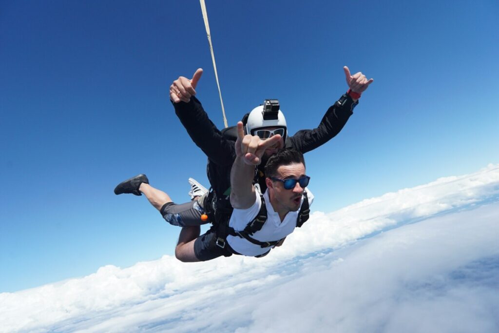 a man skydiving with a parachute